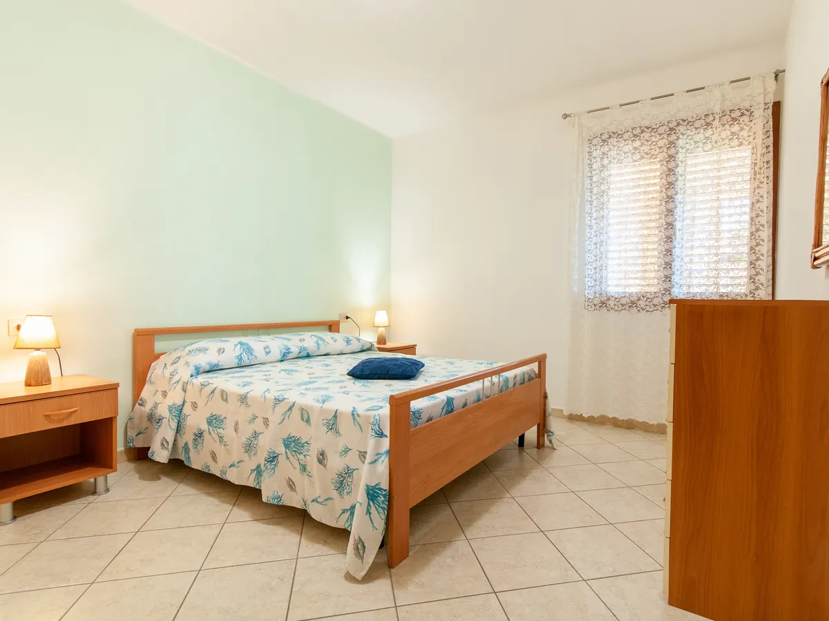 Appartamento Salvatore con veranda e giardino a La Caletta, foto 1